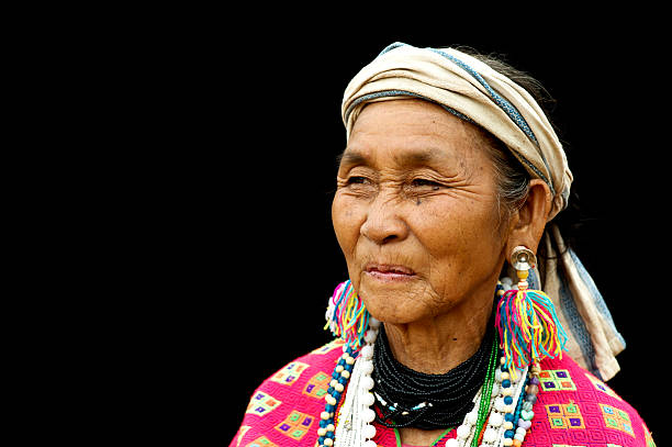 Pwo Karen Woman Pwo Karen woman in traditional dress. padaung tribe stock pictures, royalty-free photos & images