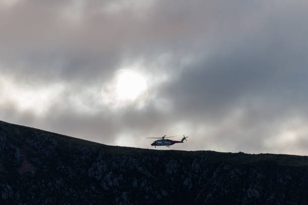 This image captures a high-altitude view of Horn Head, a dramatic coastal promontory located in County Donegal, Ireland, along the famous Wild Atlantic Way. Known for its towering sea cliffs, lush green vegetation, and rugged terrain, the area is a popular destination for nature lovers, hikers, and photographers. The cliffs rise steeply from the Atlantic Ocean, offering panoramic views of the surrounding countryside and beaches. In the background, you can see the rolling hills and distant mountain ranges of northwest Ireland, which add to the region's raw natural beauty and sense of remoteness. The landscape reflects a rich geological history and the unspoiled charm of Ireland’s western coast.