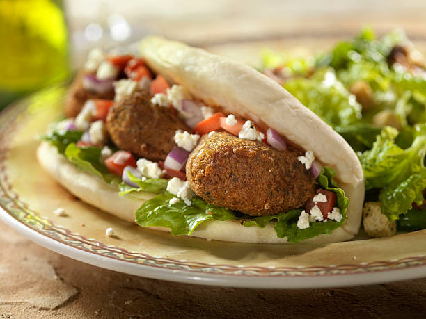 Falafel Wrap with Ceaser Salad  pita bread stock pictures, royalty-free photos & images