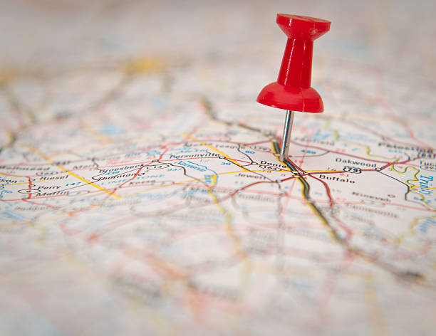Close-up of a push pin stuck in a map