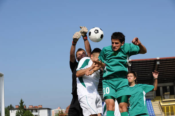 Group header Group of young male soccer players heading head shoot stock pictures, royalty-free photos & images