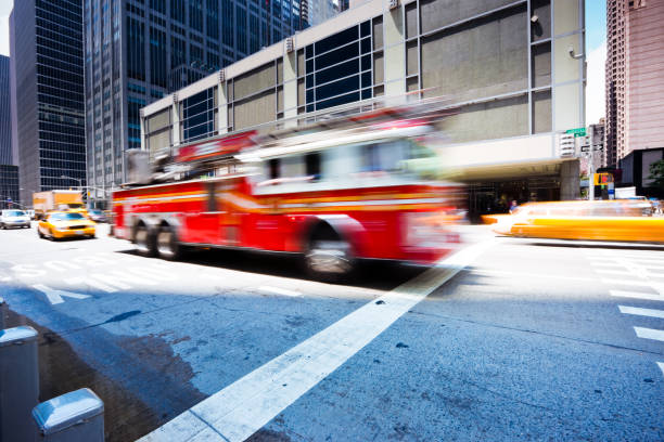 istock Fire Engine rushing through sixth avenue New York City 157476894