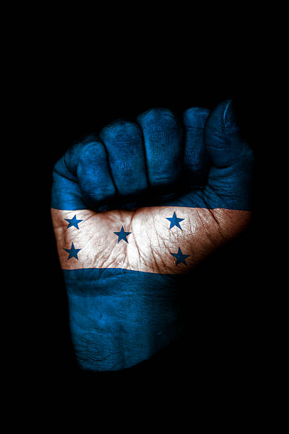Hands folded in prayer - Honduras flag painted on hands - Digitally generated