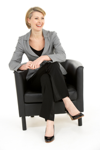 Business woman Sitting In Chair smiling