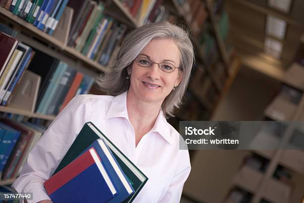 Woman In Library Series Stock Photo - Download Image Now - 45-49 Years, 50-54 Years, Adult