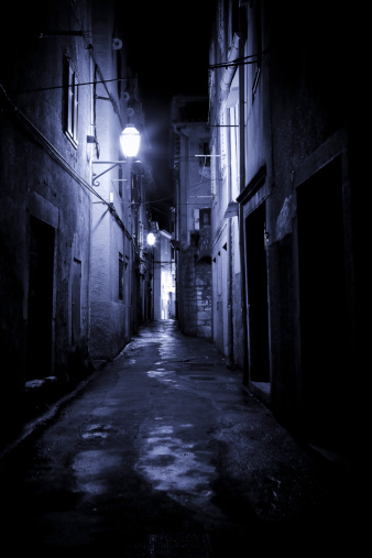 Lonely dark alley after rain. Background. Canon 5D Mk II.