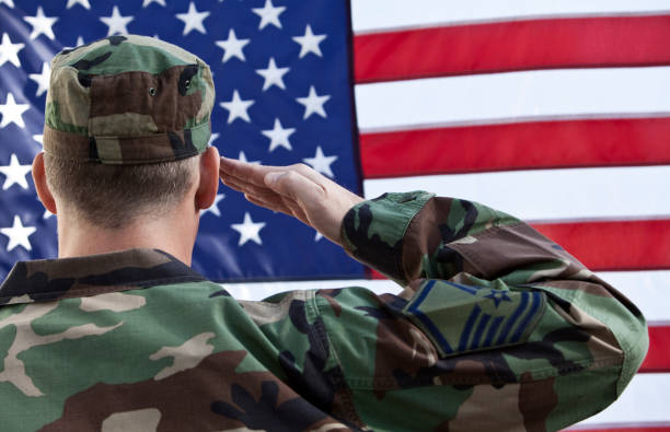 istock American Military Salute Against US Flag 157477620