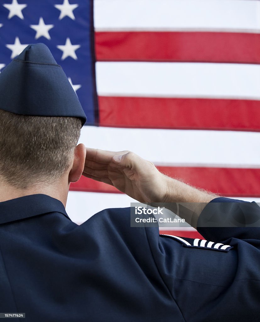 American MIlitary Service Salute US military service member in Service Dress saluting the US flag  US Air Force Stock Photo