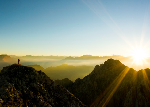 a climber observing sunset.