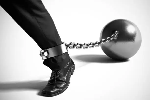 Photo of Businessman with Ball and Chain