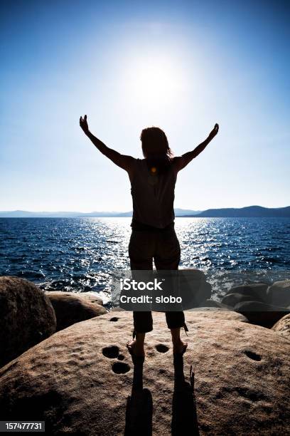 Praise The Sun Stock Photo - Download Image Now - Adult, Arms Outstretched, Arms Raised