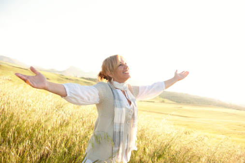 Mature woman enjoying the spring on a meadow