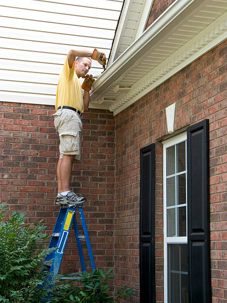 istock Homeowner Maintenance, Gutter Cleaning Working. Dangerously Standing On Ladder 157477969