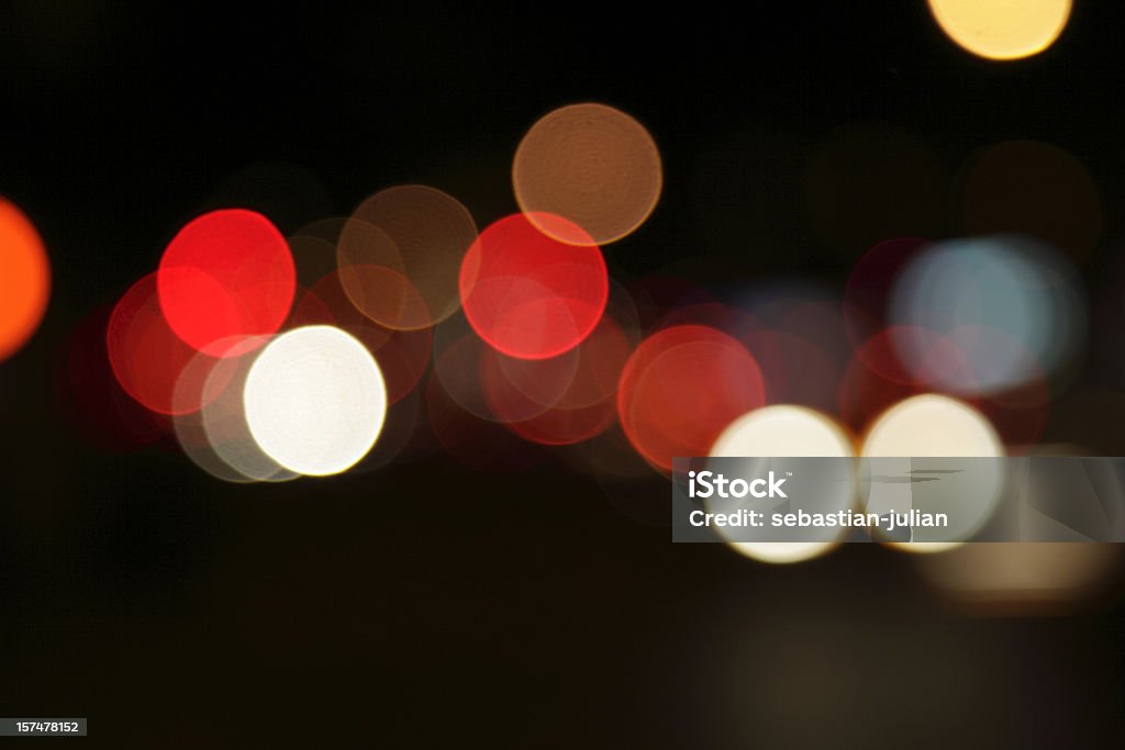 defocused light dots at manhattan traffic in twilight  Blurred Motion Stock Photo