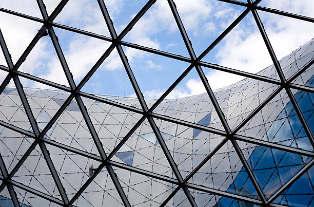 istock Glass roof construction, cloudy sky 157478195
