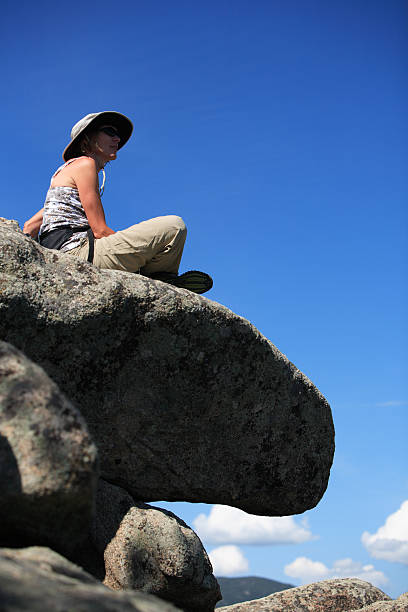 istock woman on a rock 157478299