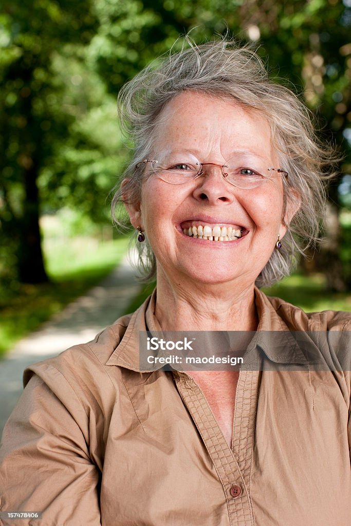 Happy Mature Woman Outdoor portrait of a mature woman smiling at camera. 30-39 Years Stock Photo