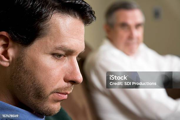 Foto de Detalhe De Homem Deprimido Com Pai Olhando Em e mais fotos de stock de Igreja - Igreja, Bíblia, Pai