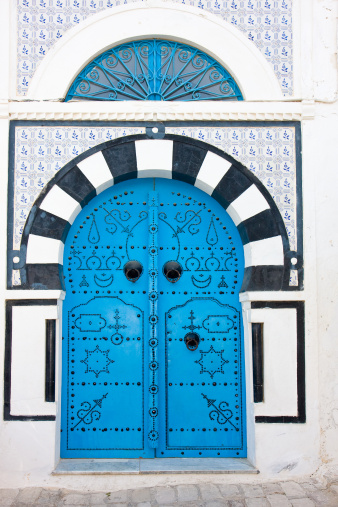 Tunis, Tunisia. A decorated door in a keyhole arch, also known as a Moorish Arch.