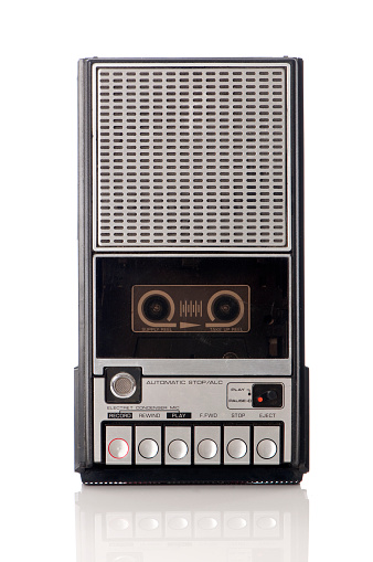 Old Retro portable tape recorder shot on white background.