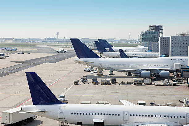 Airplanes loading on airport Filling cargo by side profile of an airplane on airport. frankfurt international airport stock pictures, royalty-free photos & images