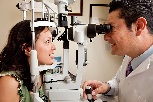 istock profile shot of optometrist eye exam 157478986