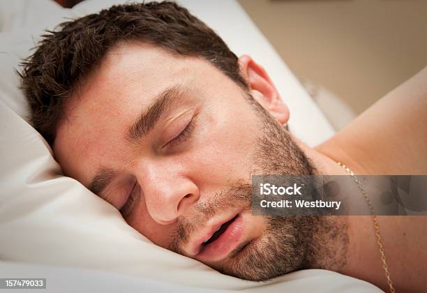 Closeup Of Young Man With Beard In Sound Sleep In Bed Stock Photo - Download Image Now