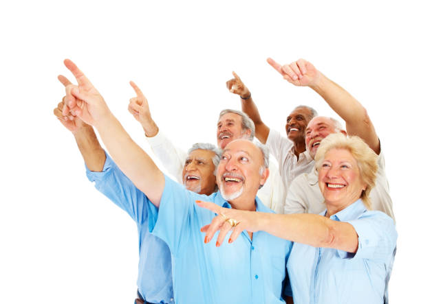 istock Happy senior men and women pointing upwards 157479081