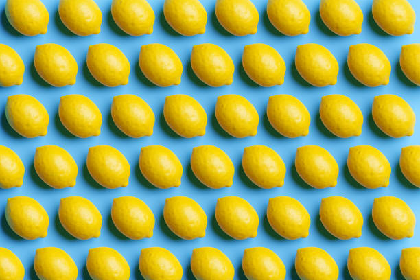 Rows of yellow lemons with shadows on pink blue background. Illustration as design element for website template background and slide show presentation wallpaper