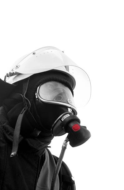 nero fire fighter con maschera isolato su bianco - radiation protection suit toxic waste protective suit cleaning foto e immagini stock