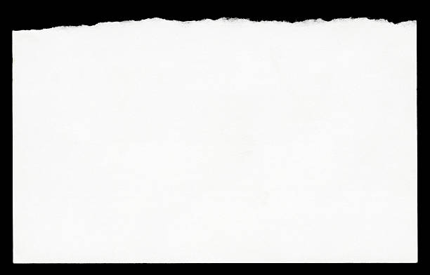 Torn Blank Note Paper High resolution image of torn note paper isolated on black background. torn paper stock pictures, royalty-free photos & images