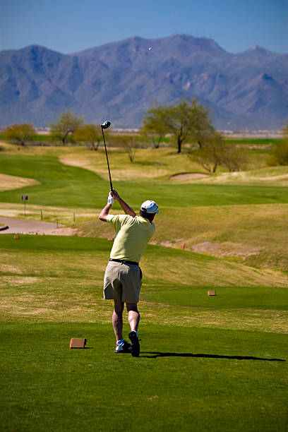 istock Golfer Swings on an Arizona Golf Course 157479270