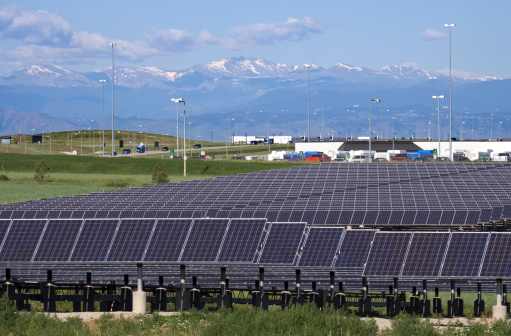 Standing near the terminal and parking, fields of solar panels provide electricity for Denver International Airport, Colorado.