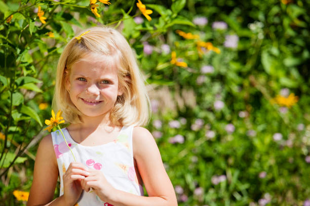 istock Girl with flower 157480479