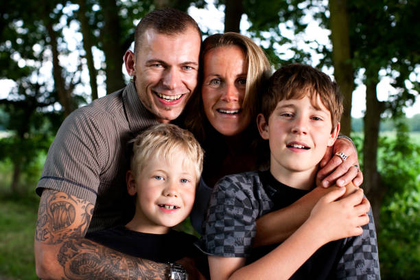 istock Young Family Posing In A Park 157480507