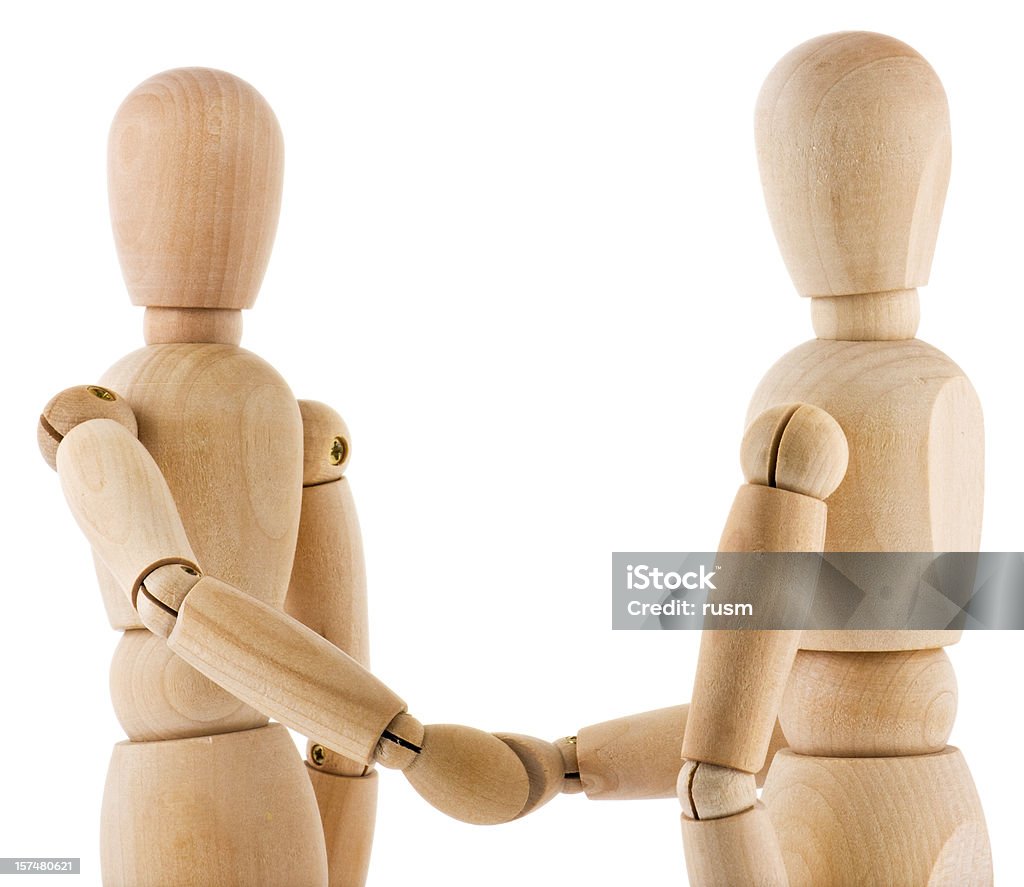 Handshake di legno su sfondo bianco - Foto stock royalty-free di Legno