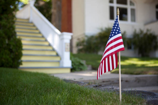 istock American Flag in Front of House 157480963