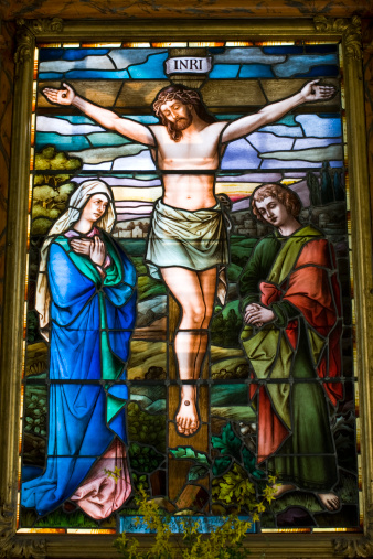 A beautiful stained glass window with Christ on the cross, donated to Munsö church in 1905 and surrounded by a wooden frame dating from 1719. Munsö church is situated on Ekerö near Stockholm. Check out my Church lightbox if you need more images like this.