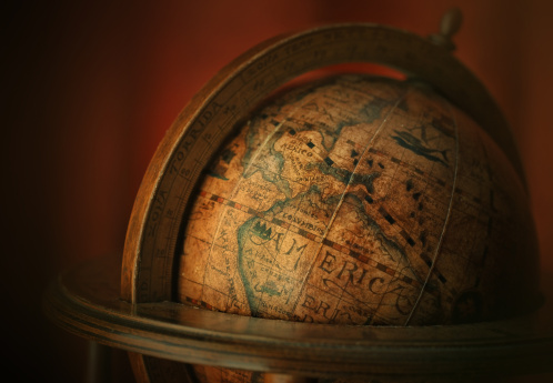 America on antique globe - low key image.