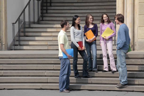 istock Group of students in discussion on staircase outdoors (XXXL) 157481380