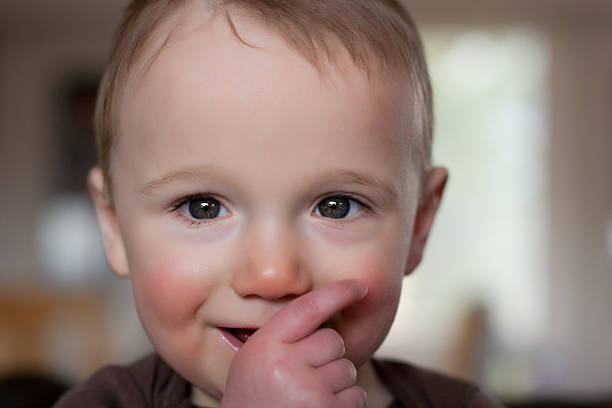 istock Baby with thumb in mouth 157481494