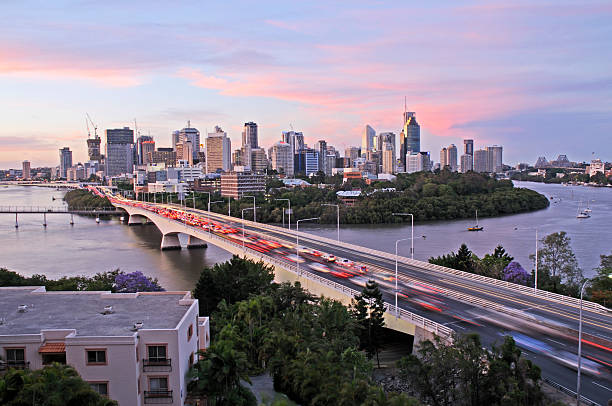 Wandsworth Bridge at Sunset: Stunning Views of London’s Urban Skyline and Vibrant River Thames Reflections captured from the Plantation Wharf Pier Ferry terminal.
