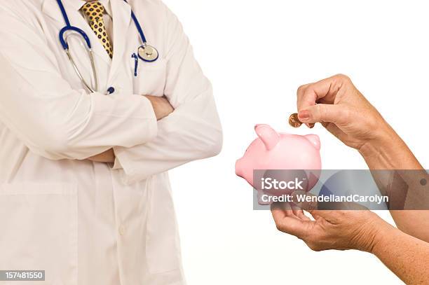 Pinching Pennies For Healthcare Stock Photo - Download Image Now - Adult, Business, Coin