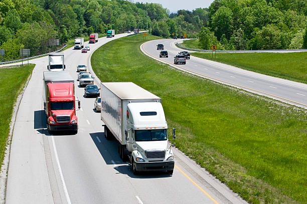 istock Trucks and cars driving on a busy interstate 157481567