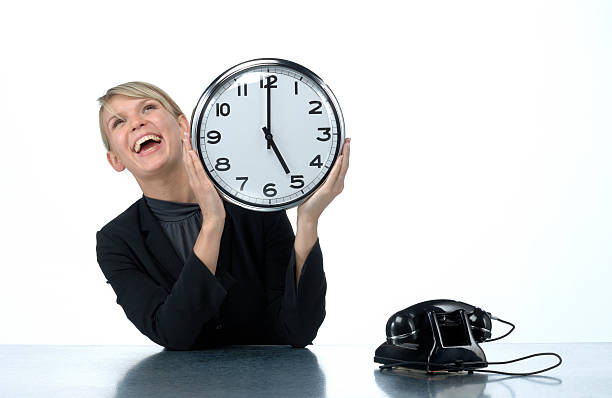 istock smiling woman holding office clock 157481884