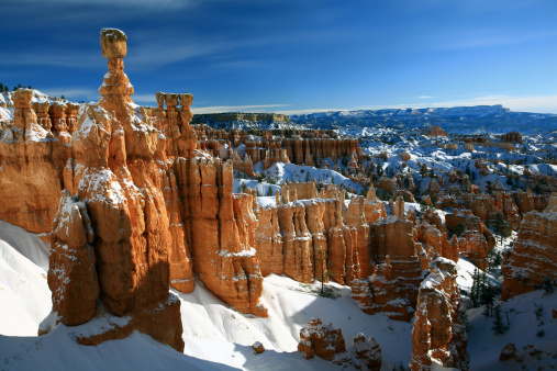 Bryce Canyon and Thor's Hammer.Thor's Hammer in Bryce Canyon. A winter scenic of Bryce Canyon, Utah. Colorado Plateau. This stunning scene, one of the most famous in the Midwest, is a striking example of water erosion. This National Park is frequented by photographer's for it's beauty, geographic and rock formations, and photographic potential. Thor's Hammer is one of the most famous sights at the sunrise viewpoint. 
