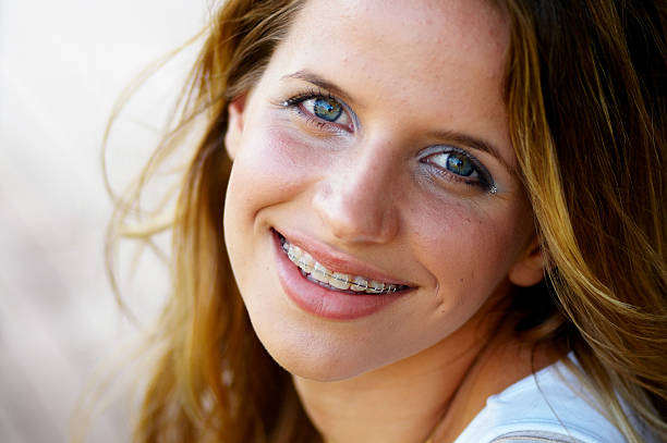 Smiling teenage girl with braces stock photo