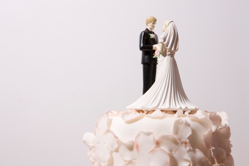 Happy couple figurine on the top of the Wedding Cake.