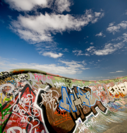 Graffitti wall with a blue sky