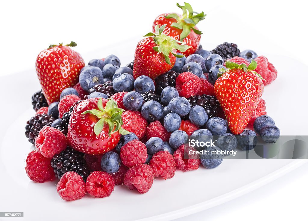 Fresh berries Fresh berries' fruit salad, isolated on white background. Studio shot. Beauty In Nature Stock Photo